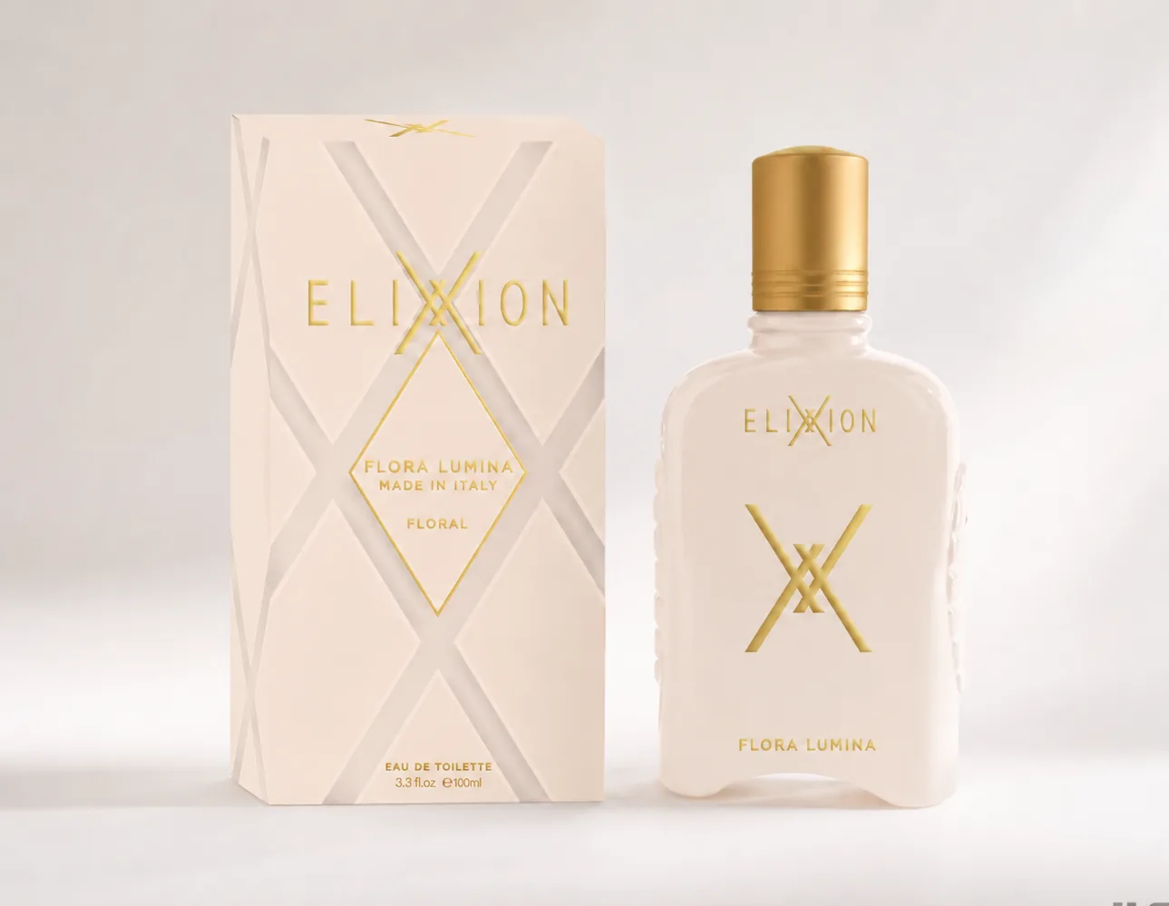 ELIXXION Flora Lumina Eau de Toilette in blush pink with its gold-foiled carton